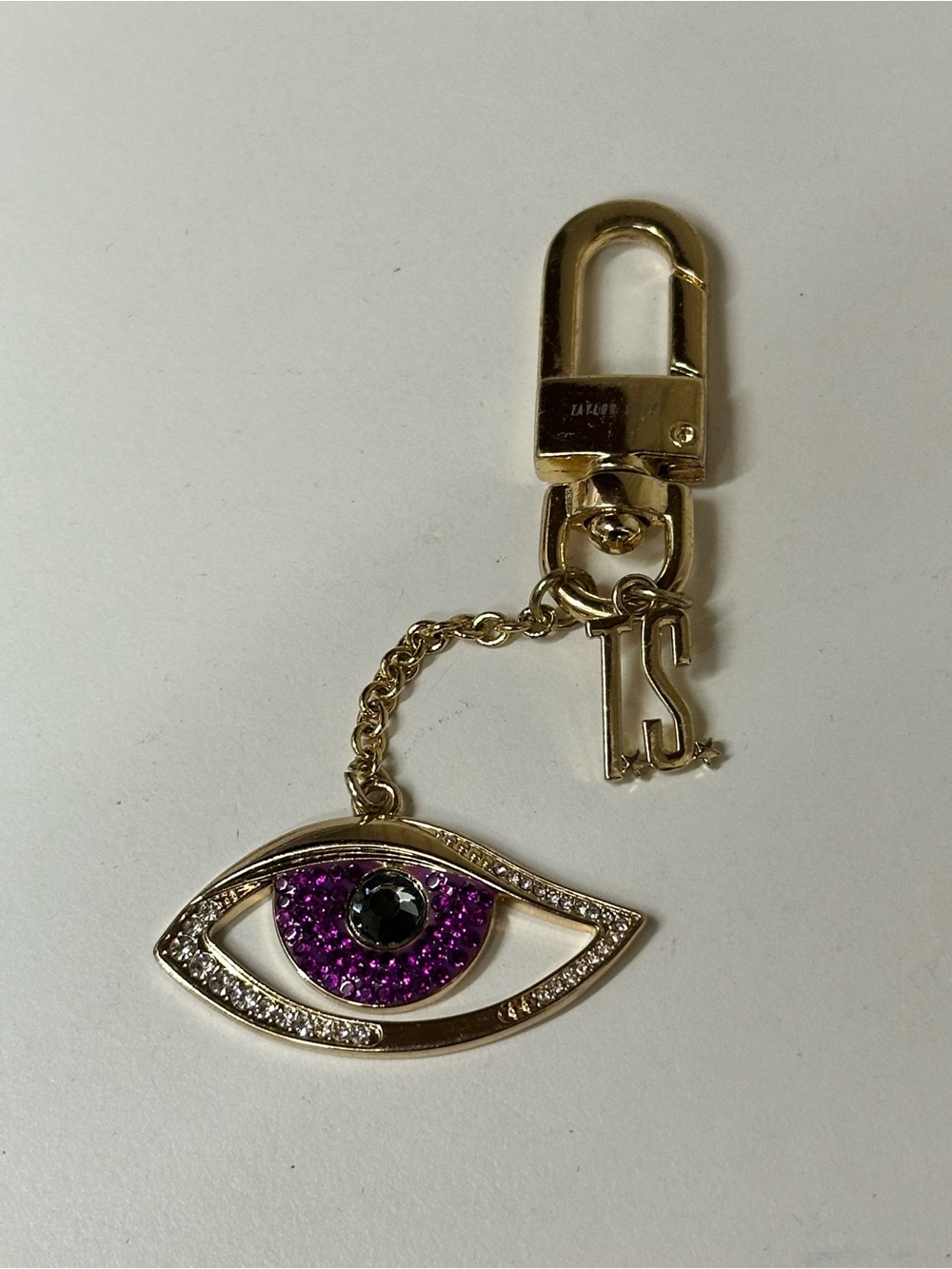 Taylor Swift Gold-Tone Eye Charm Keychain with Purple Crystal Accent